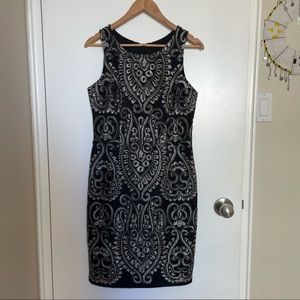 Gorgeous fitted black dress with silver design